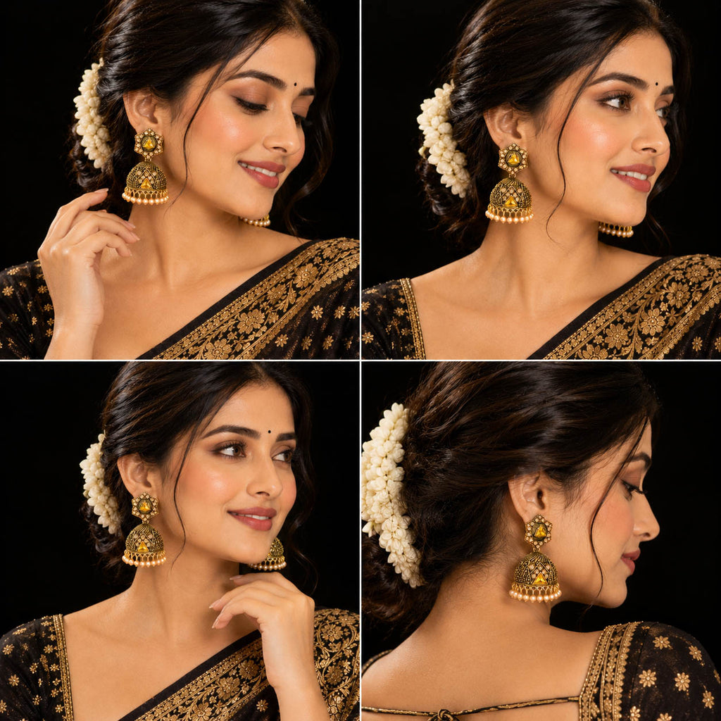 Elevate your ethnic look with these designer antique gold-finish jhumka earrings, featuring intricate detailing, sparkling stones, a statement triangular centerpiece, and delicate pearl-bead drops. Perfect for sarees, lehengas, festive outfits, weddings, and traditional occasions.

Detailed Product Description

Add a touch of royal Indian elegance to your jewellery collection with these beautifully crafted traditional jhumka earrings for women. The earrings feature an ornate antique-gold finish with intrica