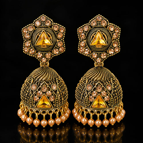 Elevate your ethnic look with these designer antique gold-finish jhumka earrings, featuring intricate detailing, sparkling stones, a statement triangular centerpiece, and delicate pearl-bead drops. Perfect for sarees, lehengas, festive outfits, weddings, and traditional occasions.

Detailed Product Description

Add a touch of royal Indian elegance to your jewellery collection with these beautifully crafted traditional jhumka earrings for women. The earrings feature an ornate antique-gold finish with intrica
